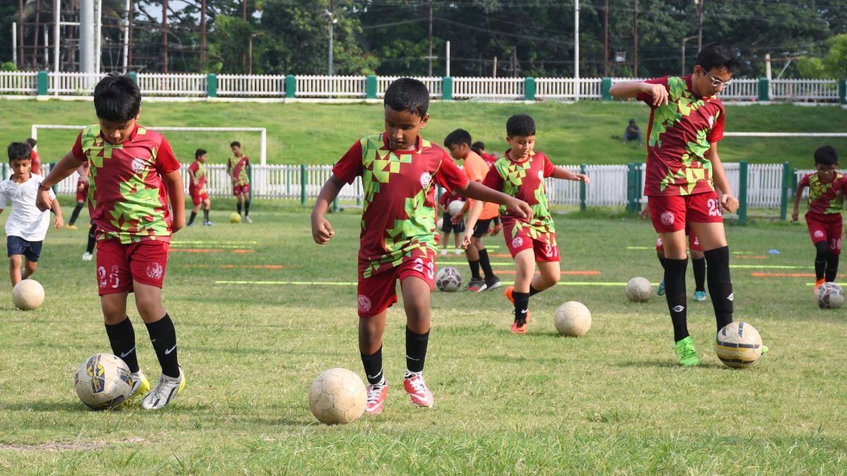 Children play football at Judges Field in Guwahati