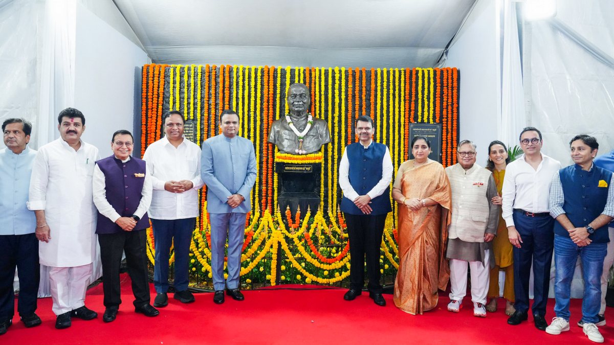 Maharashtra Chief Minister Devendra Fadnavis in a group photo as he unveils the…