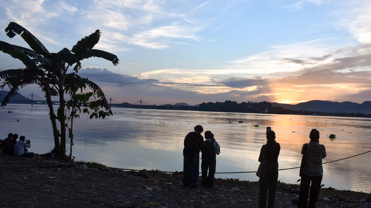 People enjoying an evening at the bank of the river Brahmaputra, in Guwahati on…