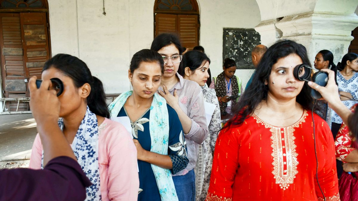 Aspirants undergo security check before UPTET 2026 exam in Prayagraj