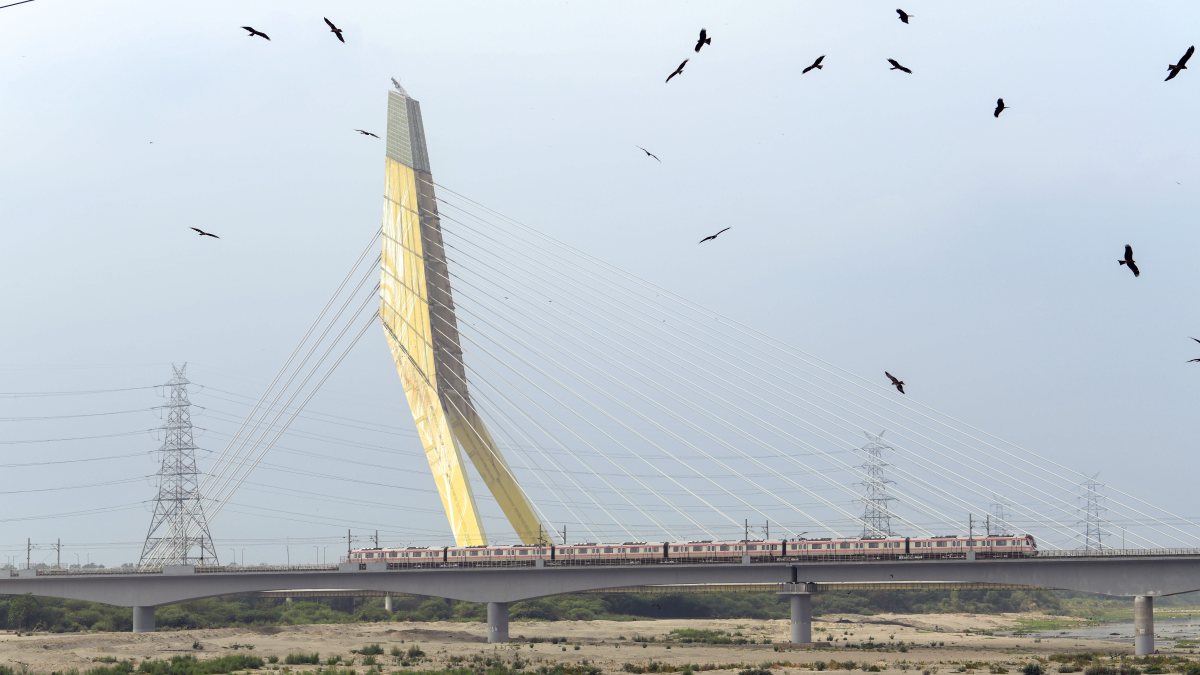Signature bridge stands over dried Yamuna riverbed in Delhi