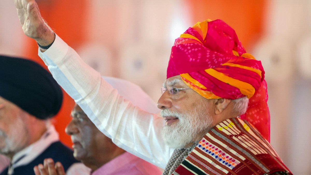 Prime Minister Narendra Modi waves during the inauguration and foundation stone…