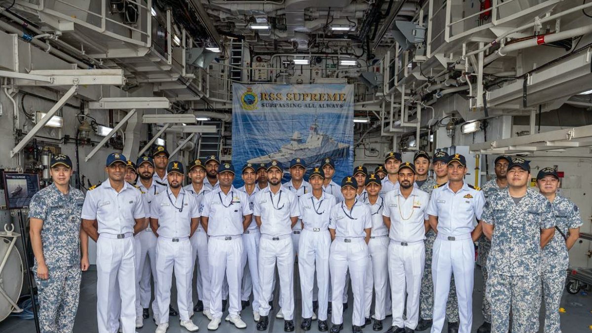 Officers of the Indian Navy and Singapore Navy pose for a group photo during…