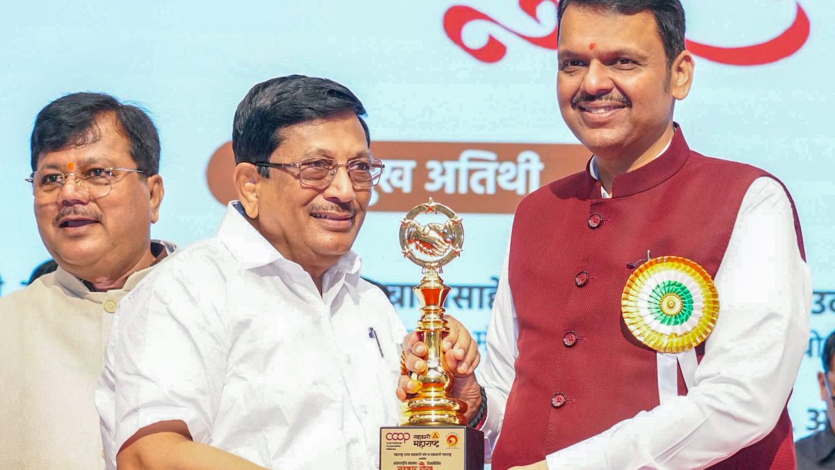 Maharashtra CM Fadnavis poses at Sahakar Gaurav Awards event