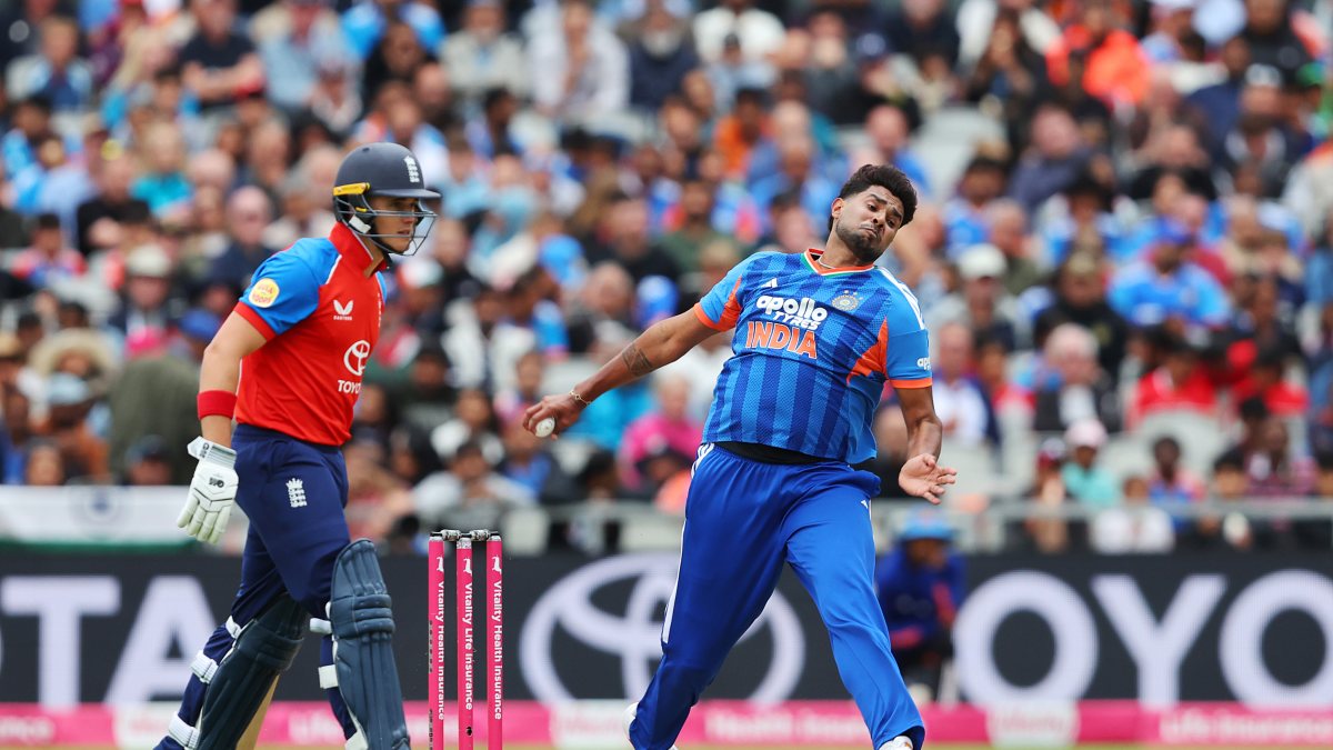 India's Harshit Rana bowls during the 2nd T20I against England, at Emirates Old…