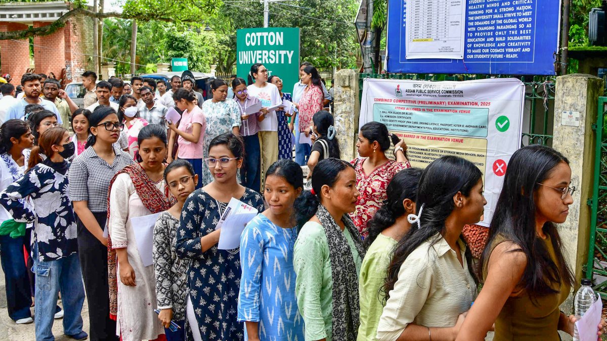 Candidates stand in a queue for the APSC Combined Competitive Examination…