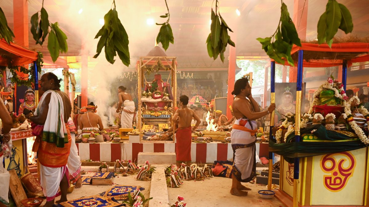 Priests perform rituals at Uttara Swami Malai Temple in Delhi
