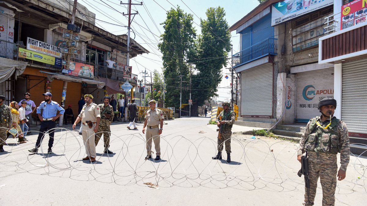 Security personnel guard encounter site in Shopian