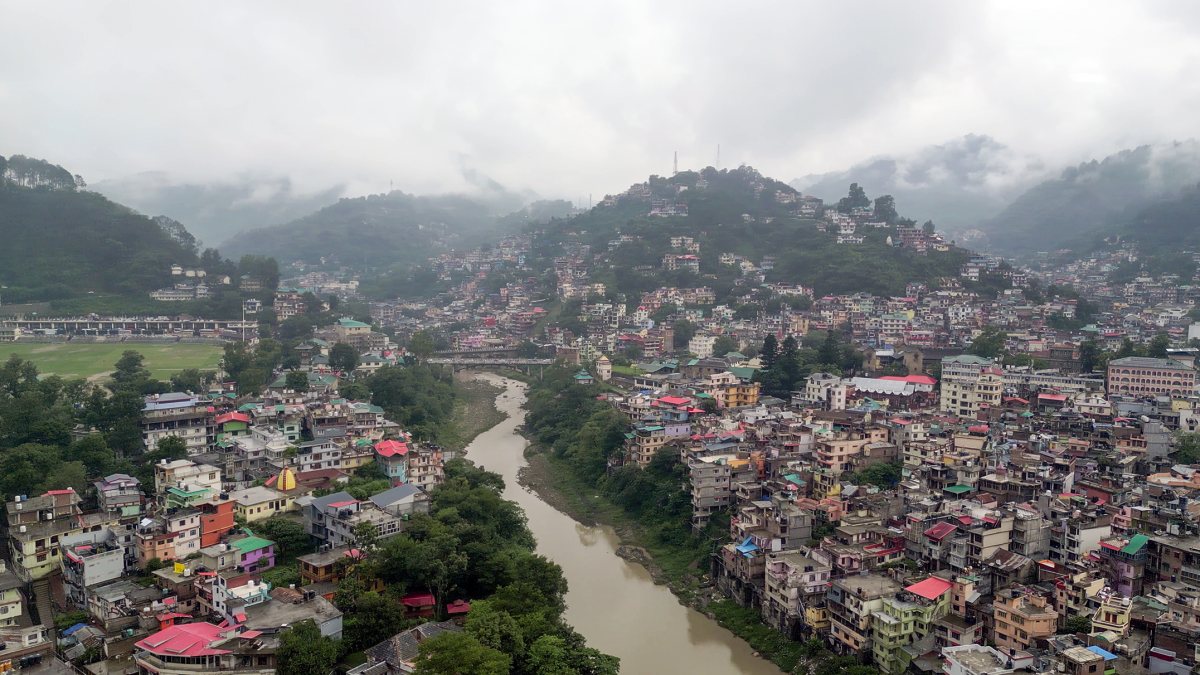A drone view of thick clouds covering the hills during the rainy season, in…