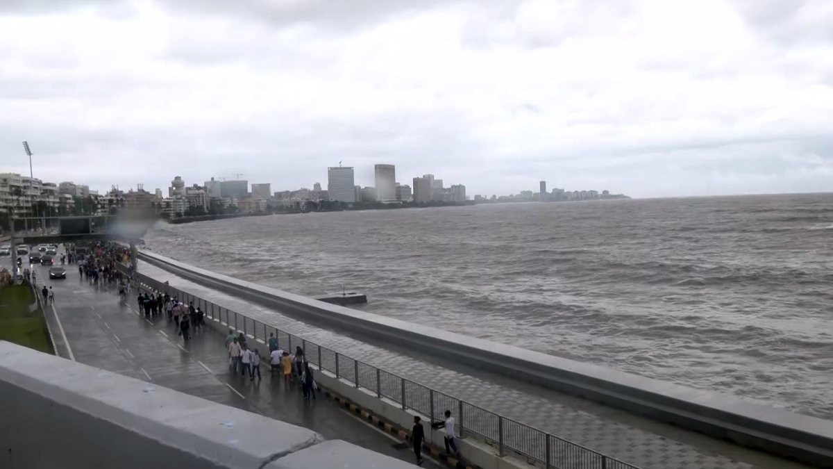 A view of the Marine Drive amid rainfall, in Mumbai on Sunday. (ANI Video Grab)