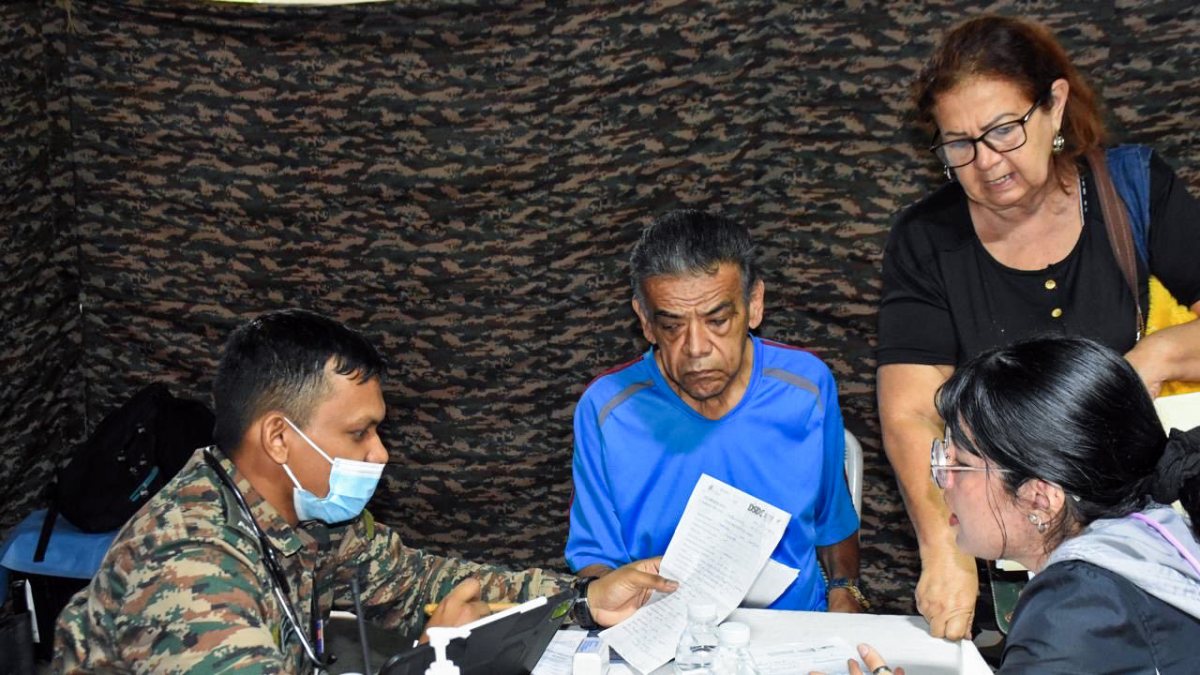 Indian Army medical personnel meets patient as part of a Humanitarian…