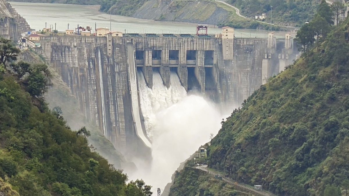 Water gushes out after three gates of Baglihar Dam are opened on the Chenab…