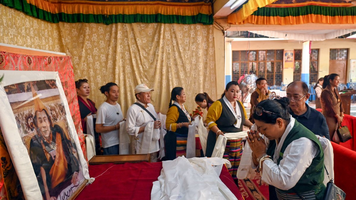 Tibetan woman prays for Dalai Lama on his 91st birthday