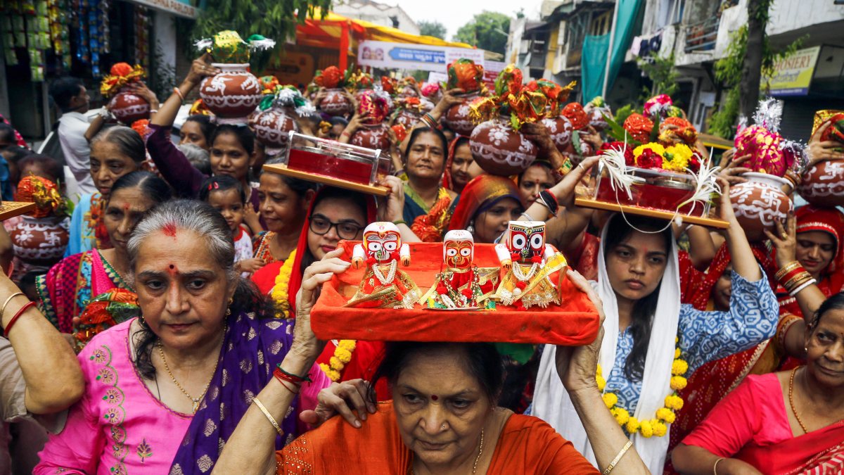 Devotees carry idols during 149th Rath Yatra Kalash Yatra in Ahmedabad