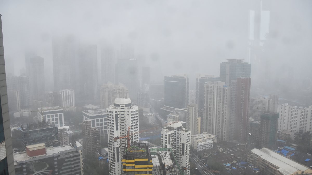 Heavy monsoon rains shroud Mumbai's high-rises