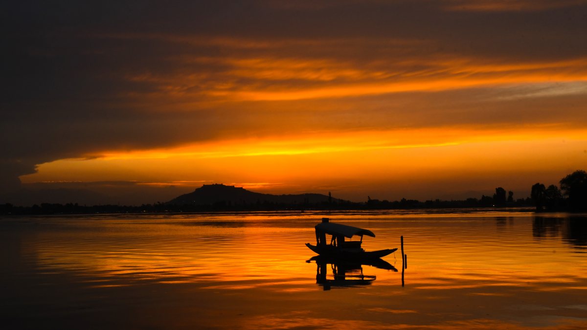 Boat docked at Dal Lake during sunset in Srinagar