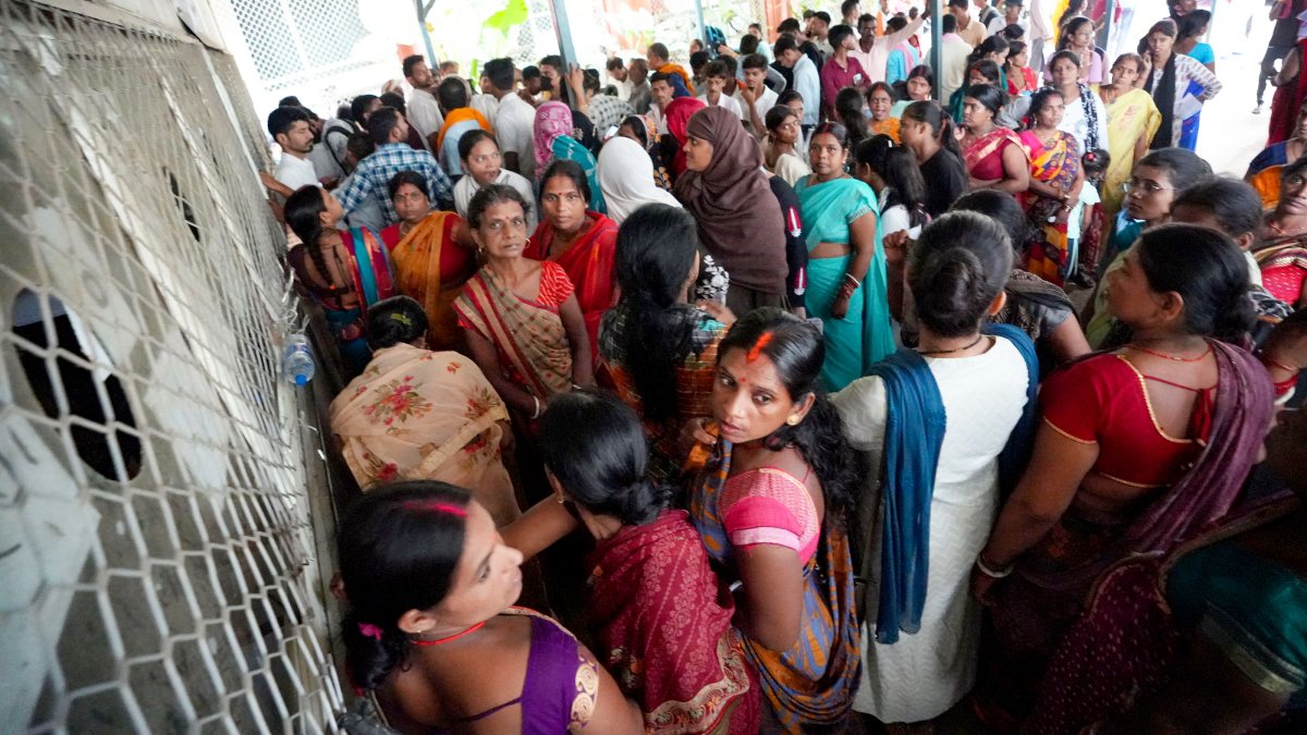 Relatives of the patients stand waiting in queues at the OPD registration…