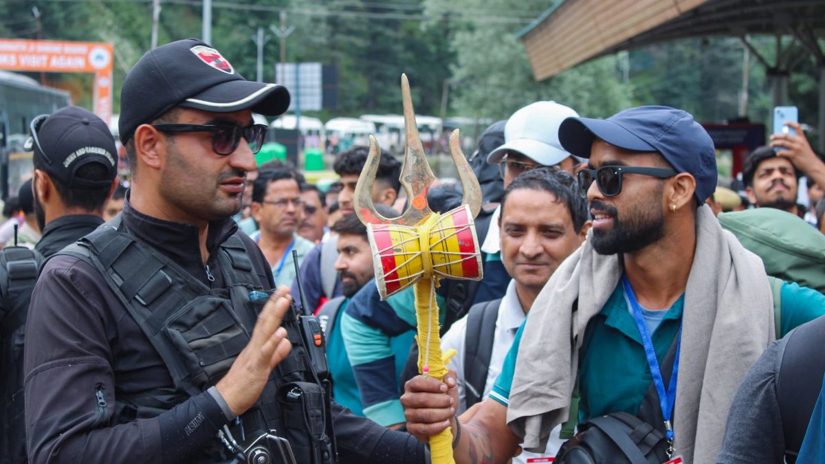 Jammu and Kashmir Police personnel assist yatris at the Nunwan base camp…