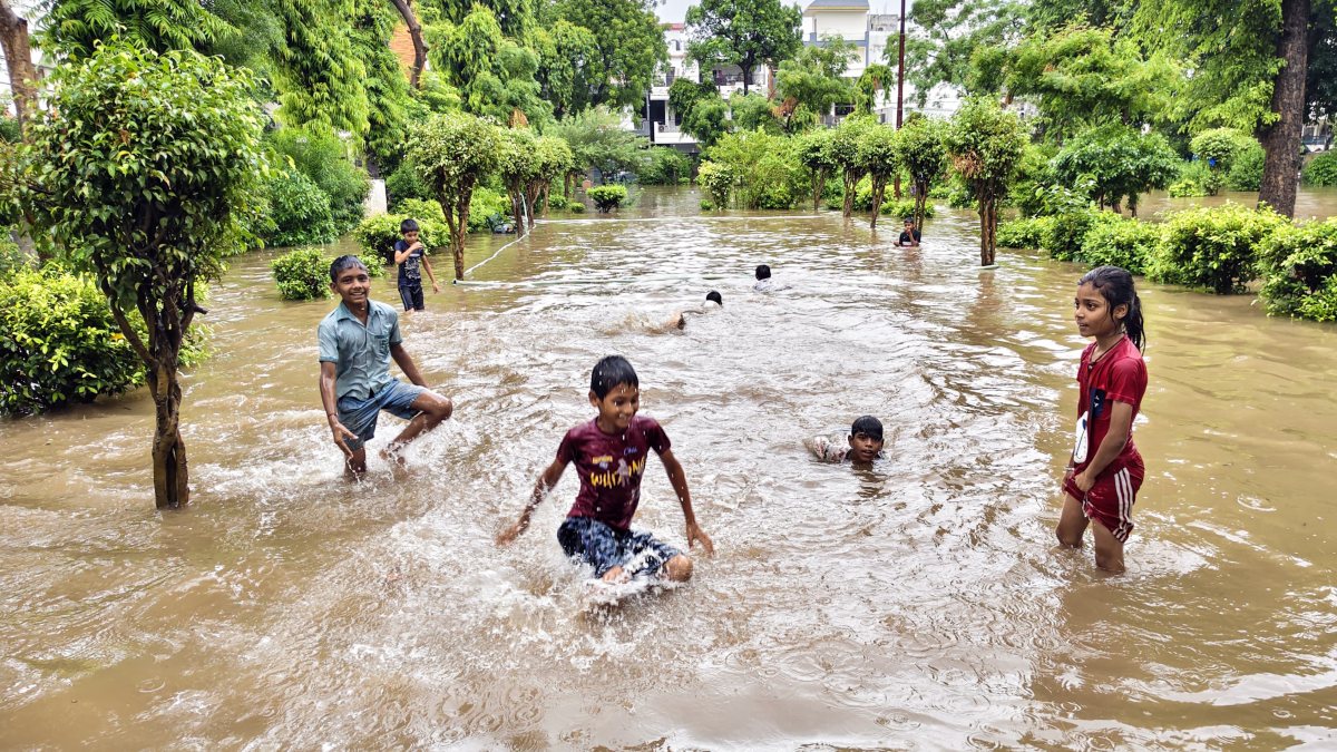 Children play in waterlogged Ghaziabad park amid heavy rain