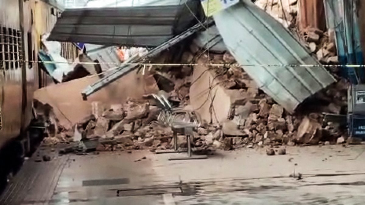A view of the debris at Railway station as portion of clock tower collapses, in…