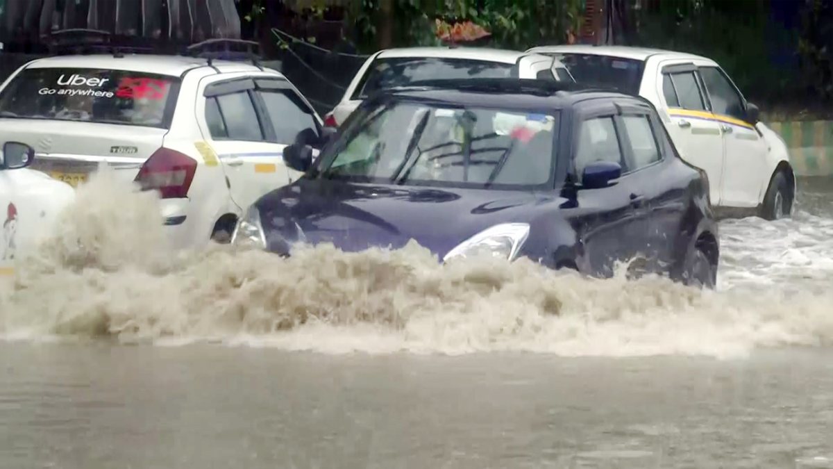 Vehicles navigate waterlogged roads after heavy rain in Ghaziabad