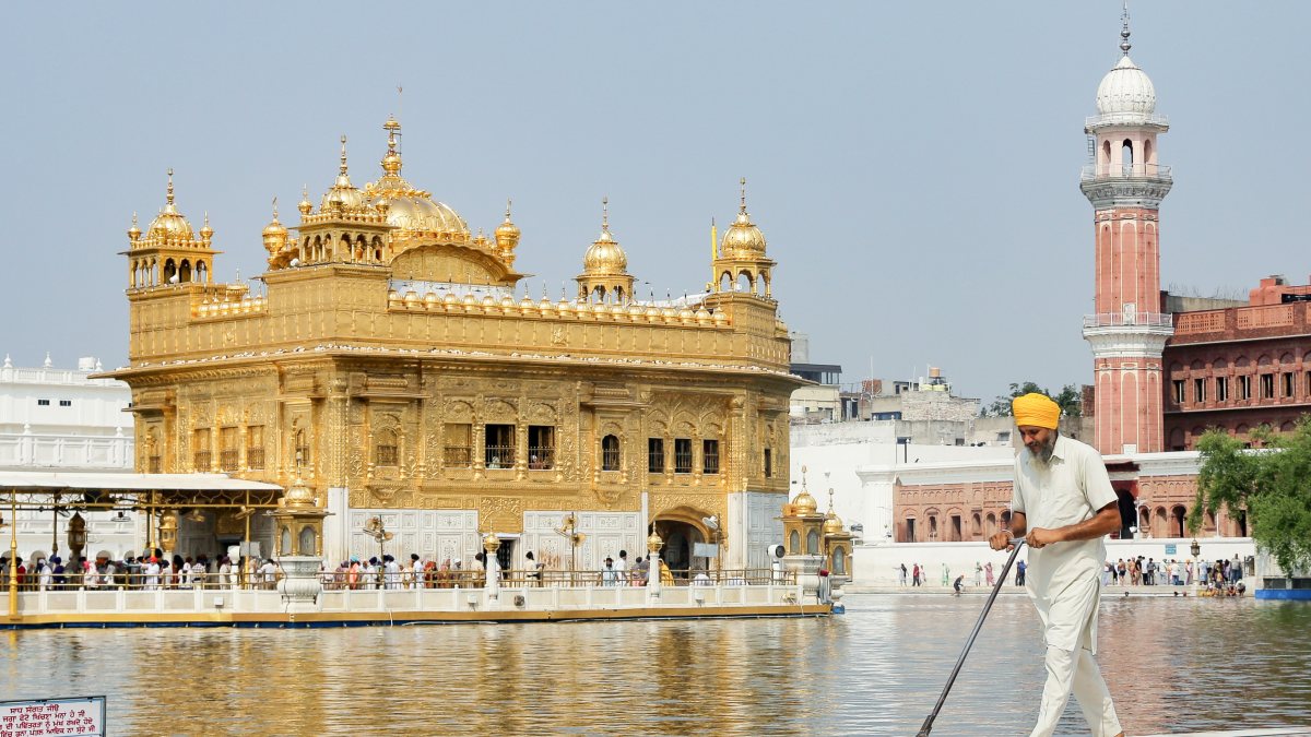 Devotee cleans Golden Temple circumambulatory in Amritsar
