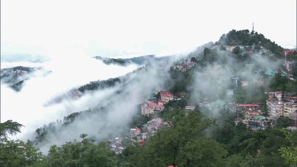 Mist covers hills and valleys in Shimla