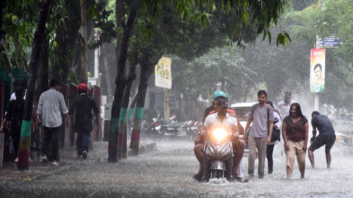 Varanasi commuters navigate waterlogged road amid heavy rain