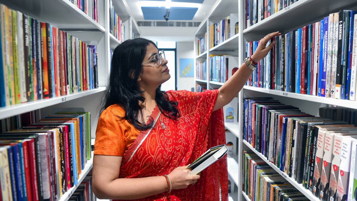 Woman browses books at newly inaugurated Delhi library