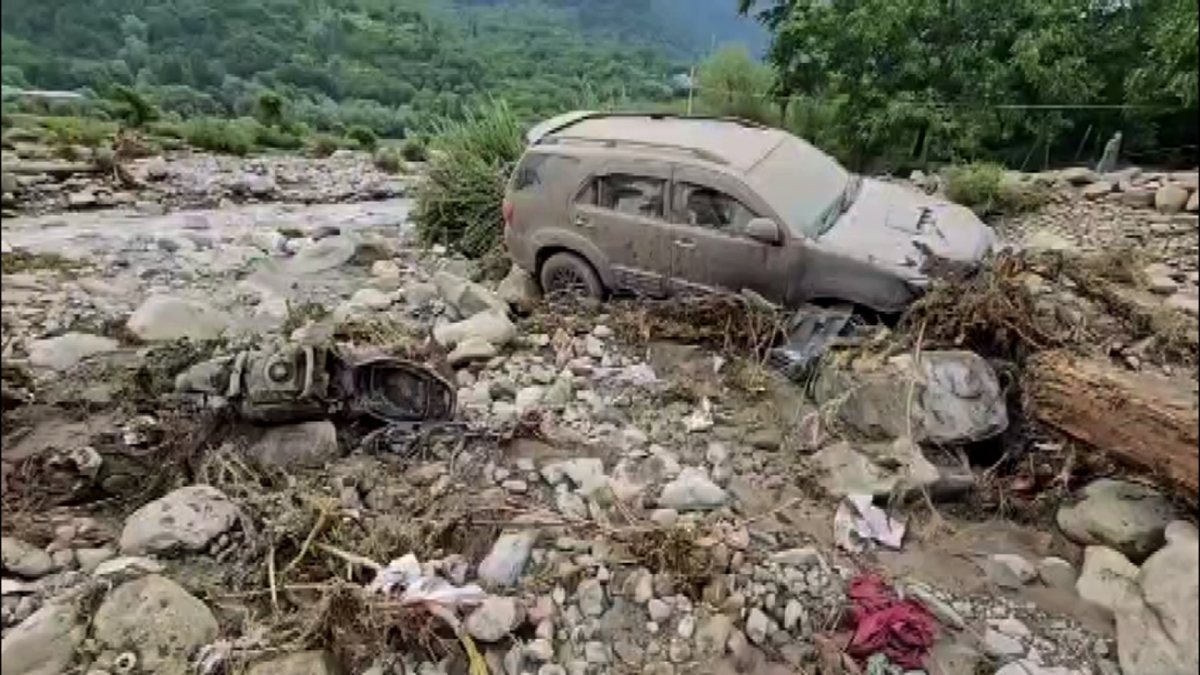 Car stuck in debris after flash flood in Pahalgam