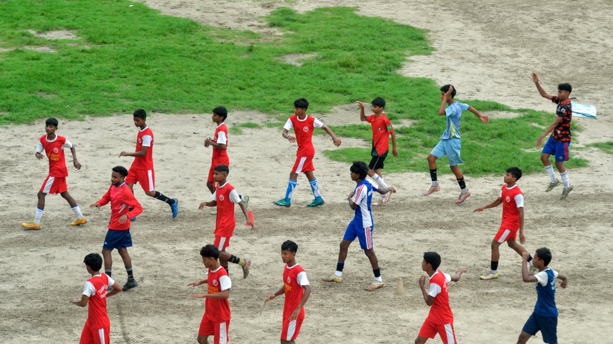 Boys warm up for football match in Siliguri