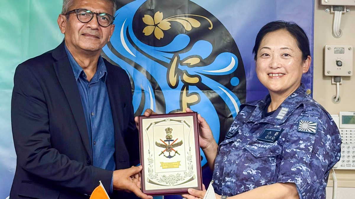 Rajesh Kumar Singh with Japanese official at Kure Naval Base