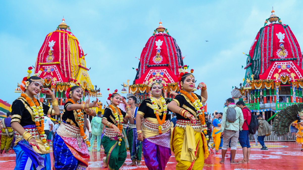 Artists perform before chariots at Puri Jagannath Rath Yatra