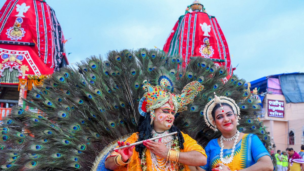 Artists as Radha-Krishna perform at Puri Rath Yatra