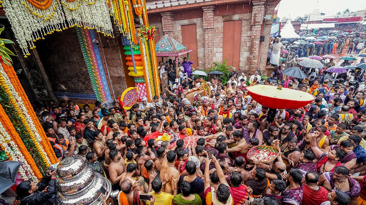 Devotees carry Goddess Subhadra during Puri Rath Yatra
