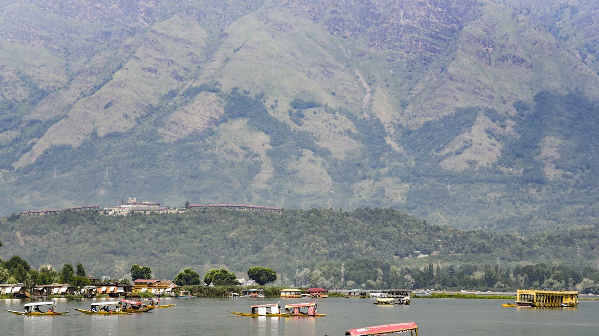 Tourists enjoy Shikara ride on Dal Lake amid summer heat
