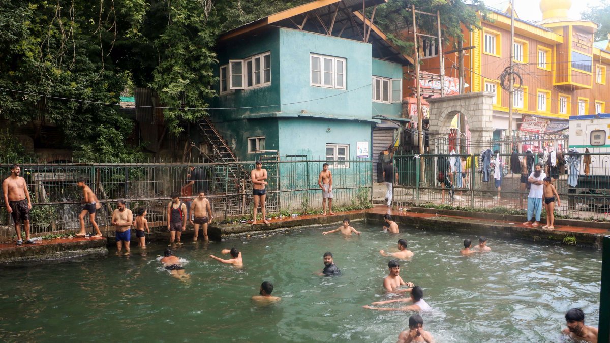 People cool off in Sherbagh Spring amid Anantnag heatwave