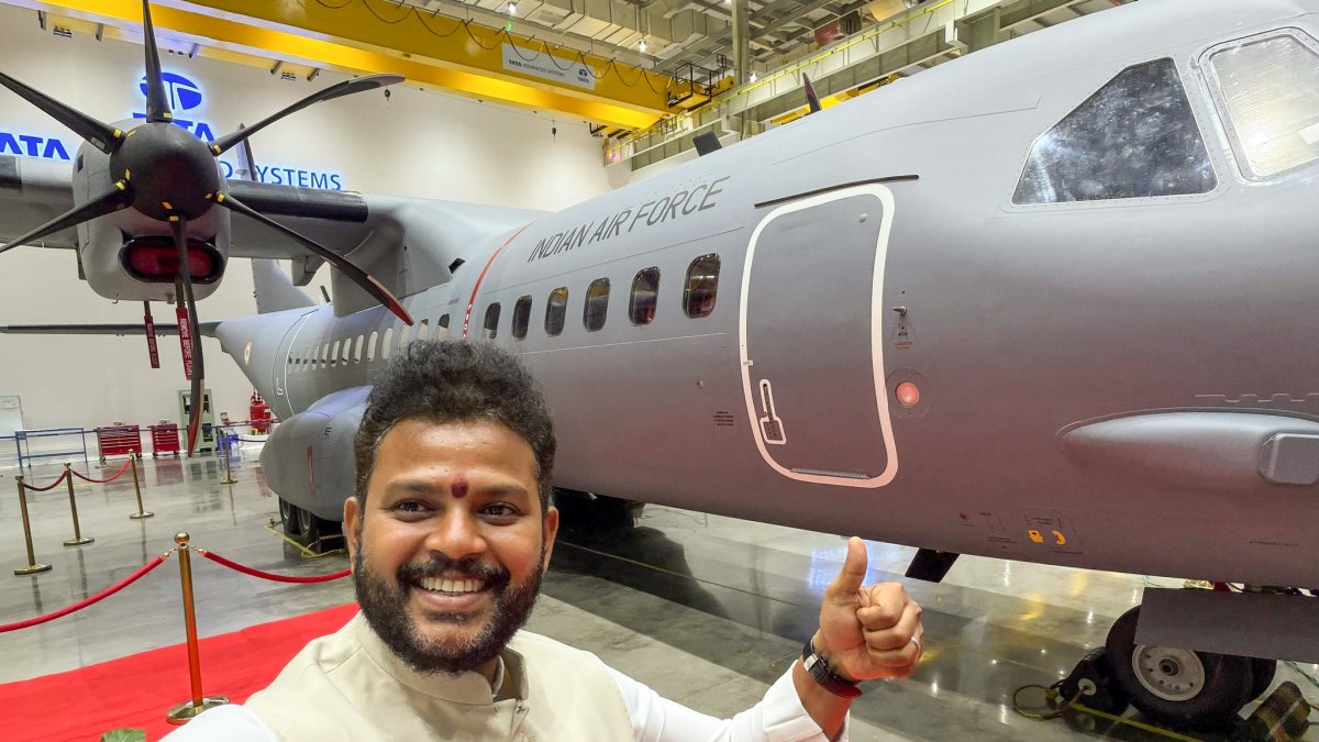 Union minister poses with first Made-in-India C-295 aircraft