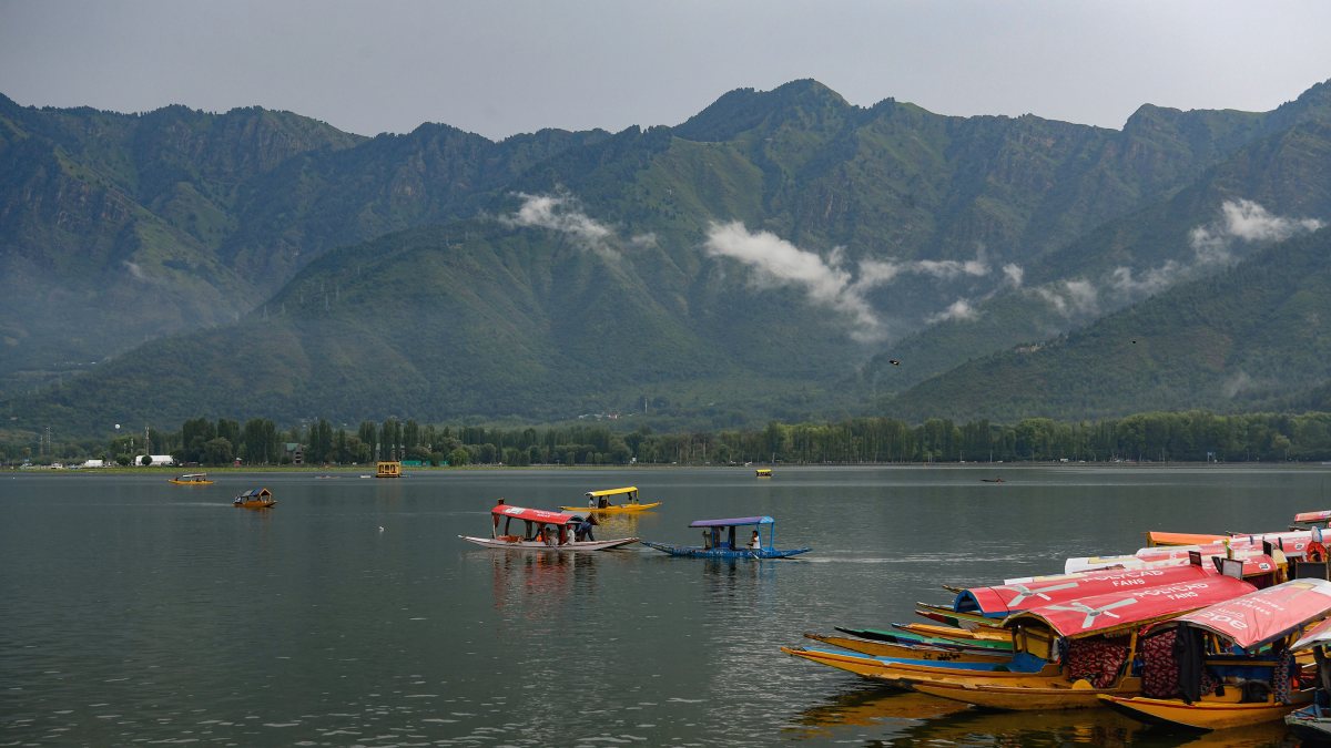 Tourists enjoy Shikara ride after heavy rain in Srinagar
