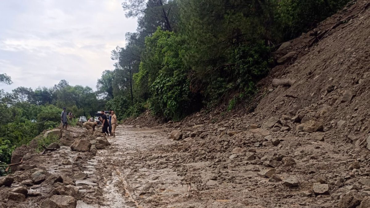Muddy path and debris after landslide in Samba