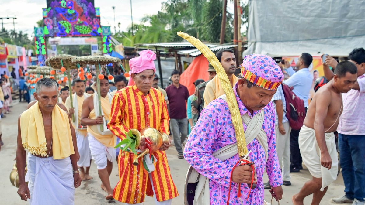 Tribal priests carry Kharchi God idols in Agartala ritual