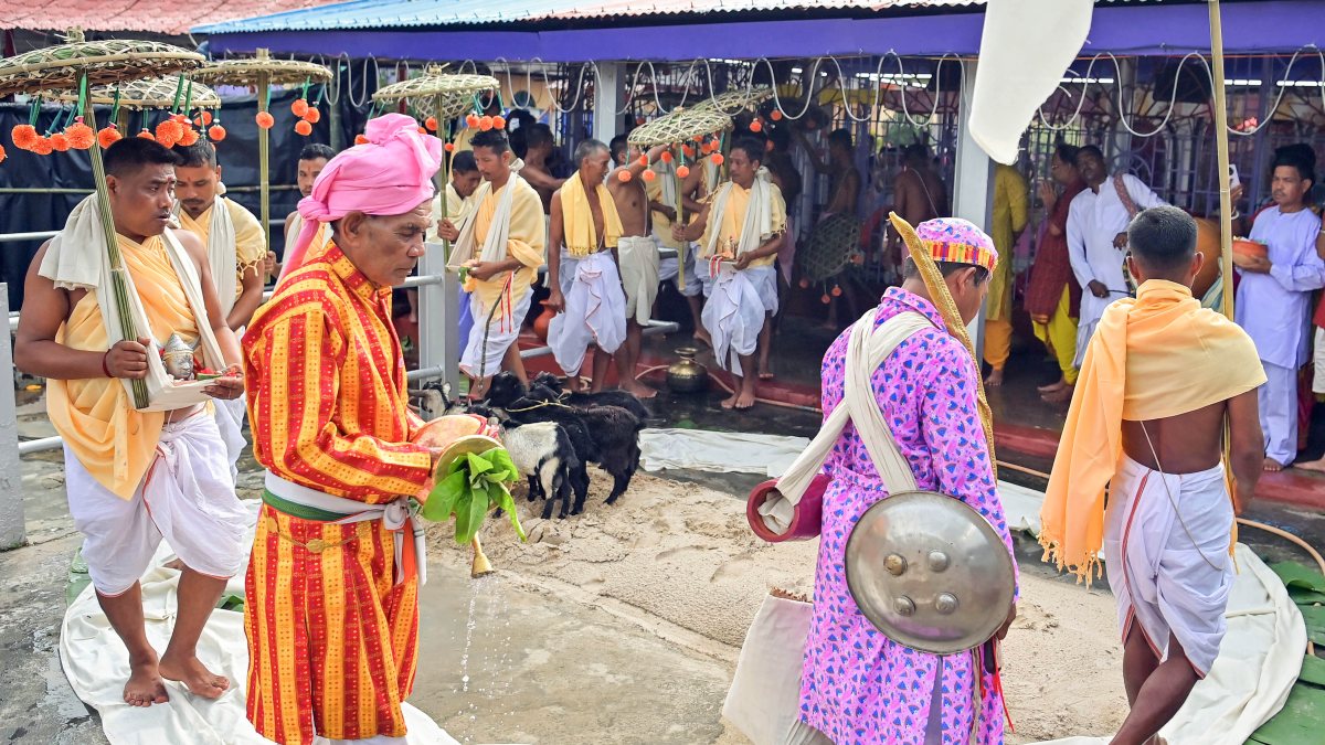 Tribal priests carry Kharchi god idols for ritual puja in Agartala