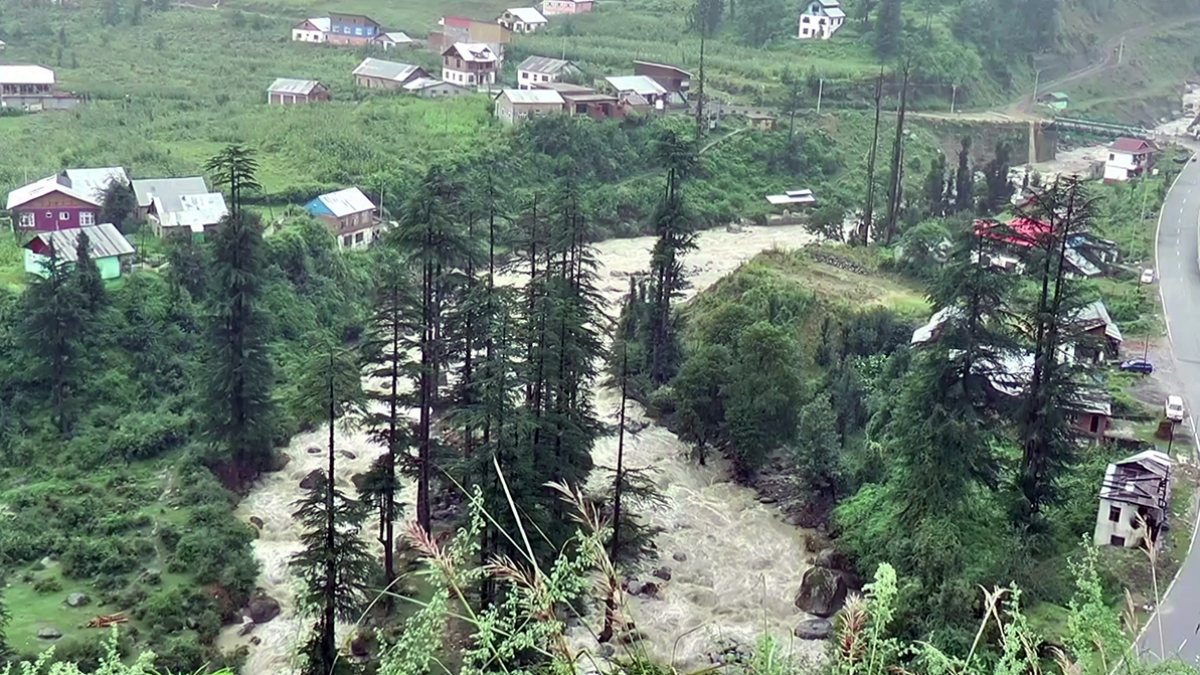 River flows through Bhalessa amid rainfall in Doda