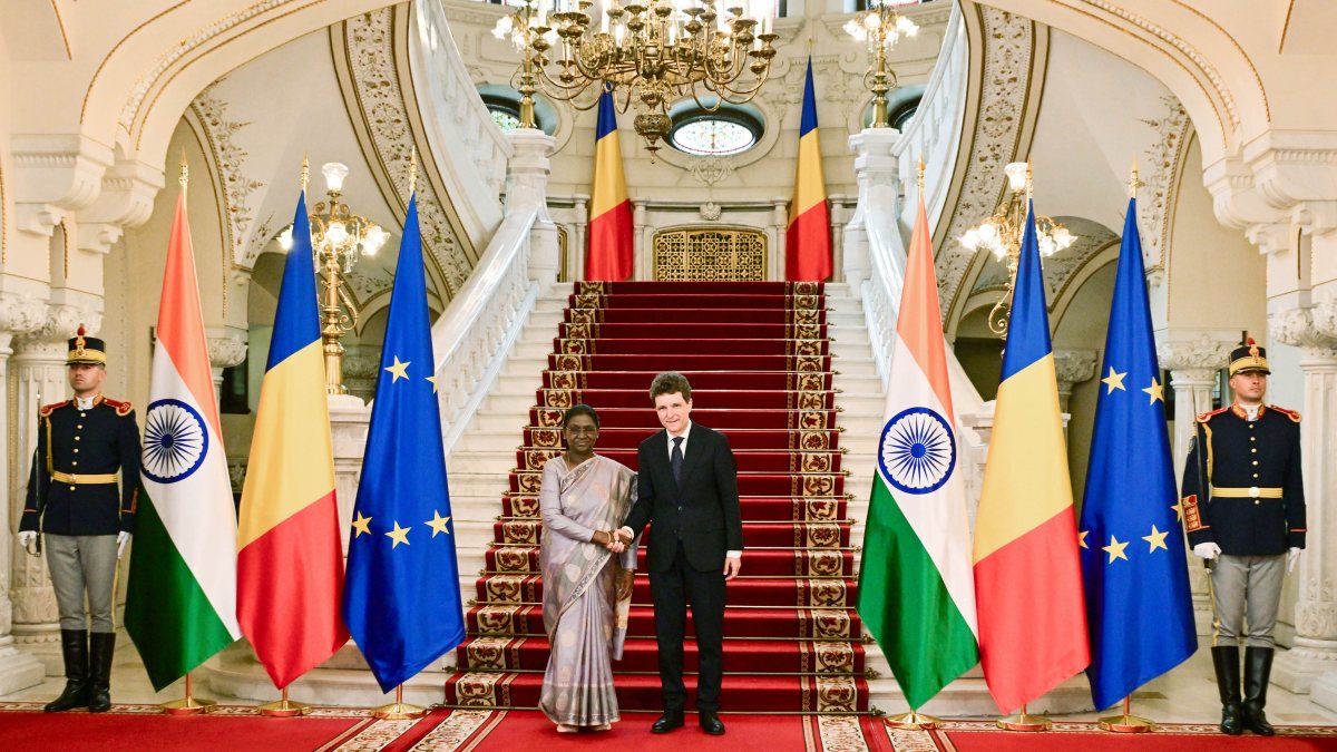 President Murmu shakes hands with Romanian President Dan in Bucharest