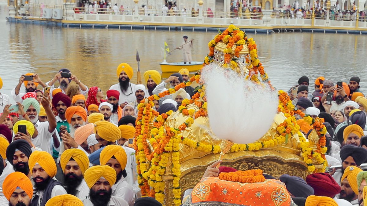 Sikh priest carries Sri Guru Granth Sahib at Miri Piri Khalsa March