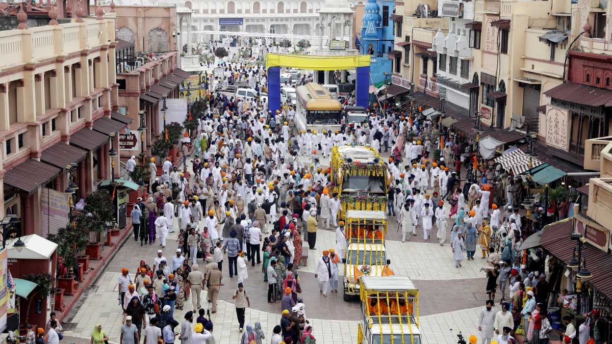 Sri Guru Granth Sahib carried in decorated bus during Miri Piri Khalsa March