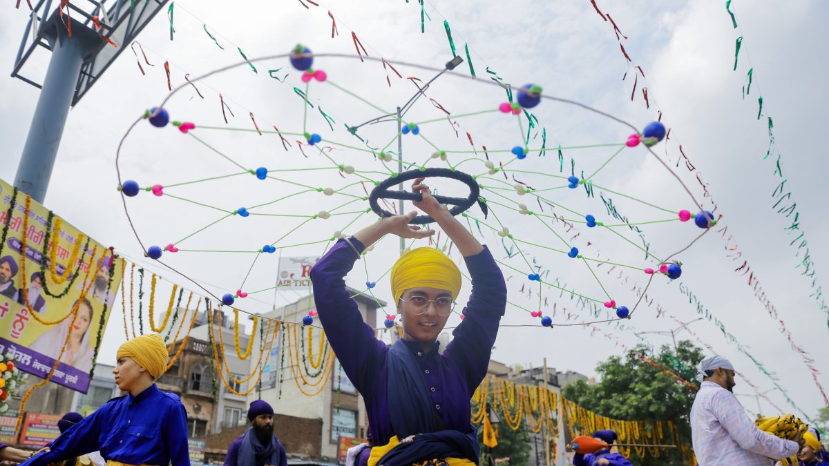 Sikh devotee performs Gatka during Miri Piri Khalsa March in Amritsar