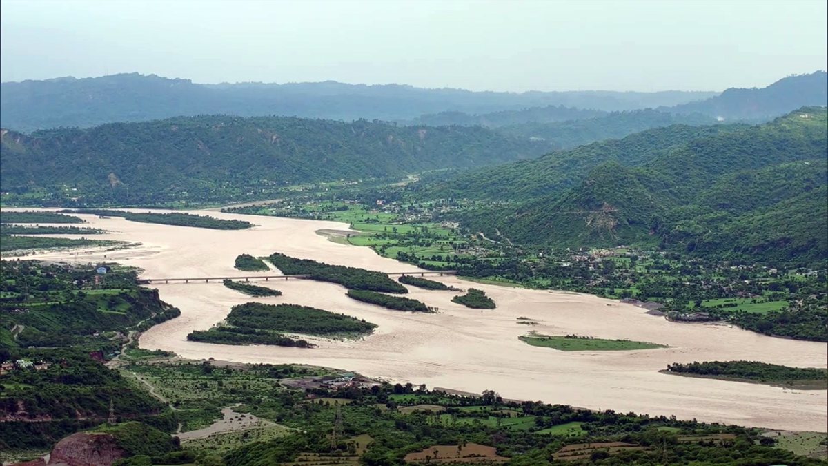 Aerial view of Salal Dam gates open after heavy rain in Reasi