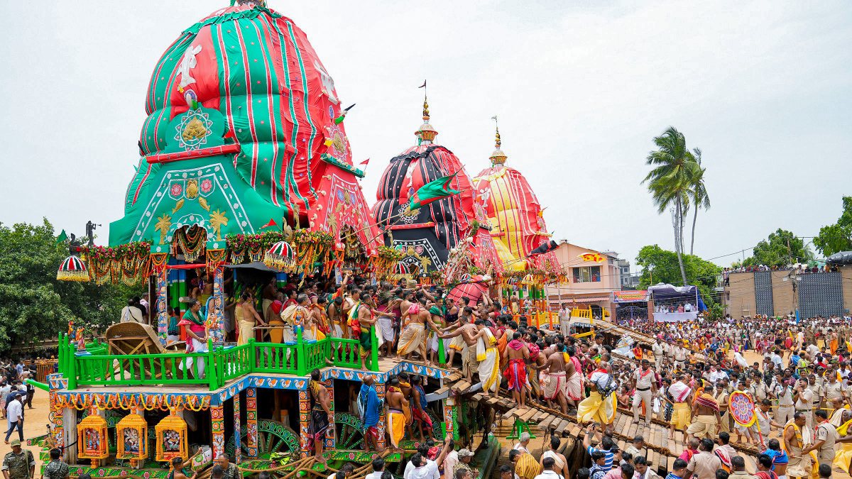 Devotees carry Lord Balabhadra during Jagannath Rath Yatra in Puri