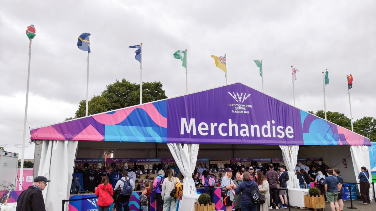 People visit a merchandise shop at the Commonwealth Games arena, in Glasgow on…